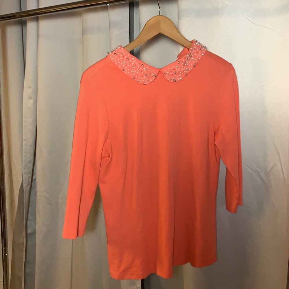 Coral colored pearled neckline